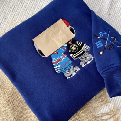 Snoopy Heated Rivalry Embroidered Sweatshirt